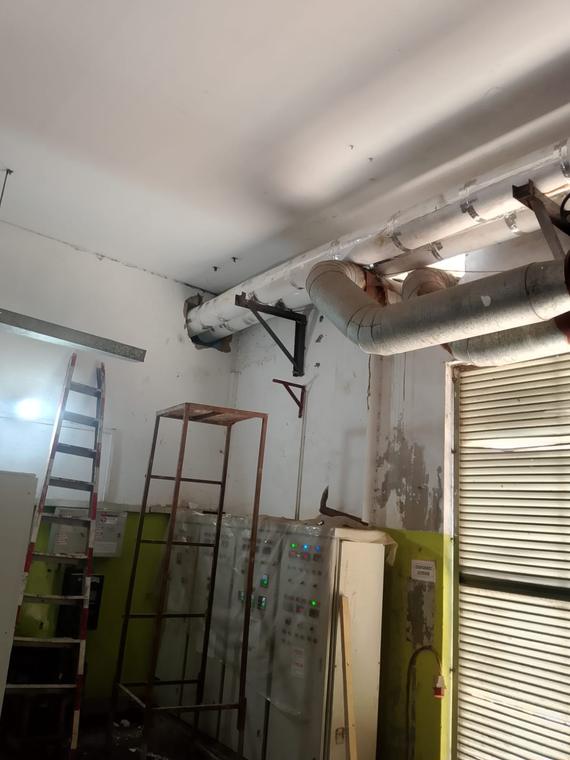 Insulated Ducting & Services — Insulated service routing above a motor control centre